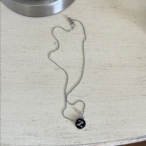 Silver Snake Pendant Necklace with Black Enamel Disc